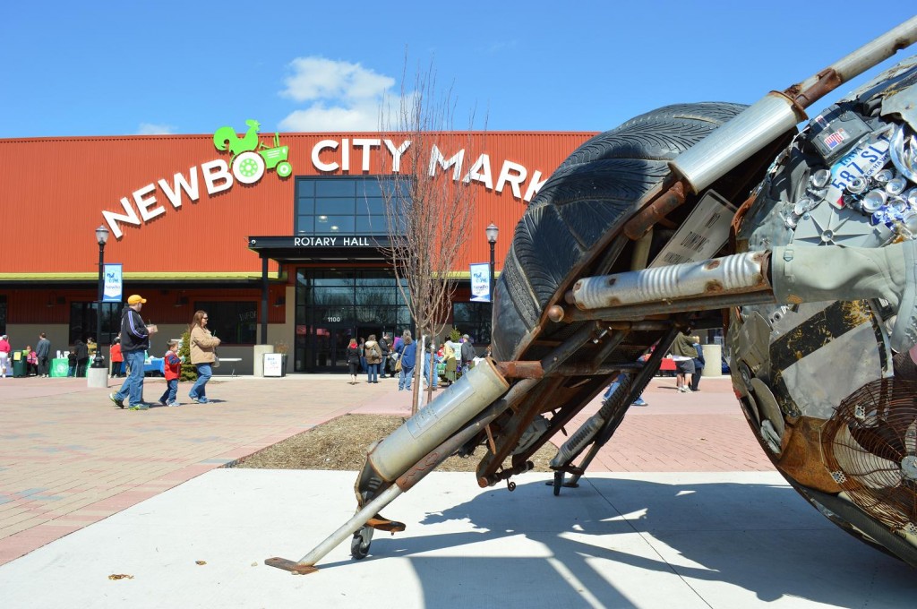 A dung beetle sculpture greets visitors to the NewBo City Market and Eco-Fest 2013 in Cedar Rapids, Iowa. The beetle is said to be among the world's most efficient recyclers, a point of emphasis for the event. (photo/Cindy Hadish) 