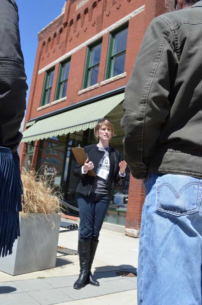 Maura Pilcher, president of the Czech Village/New Bohemia Main Street District, describes the 1907 Suchy Building during an architectural walking tour as part of Eco-Fest 2013. (photo/Cindy Hadish)