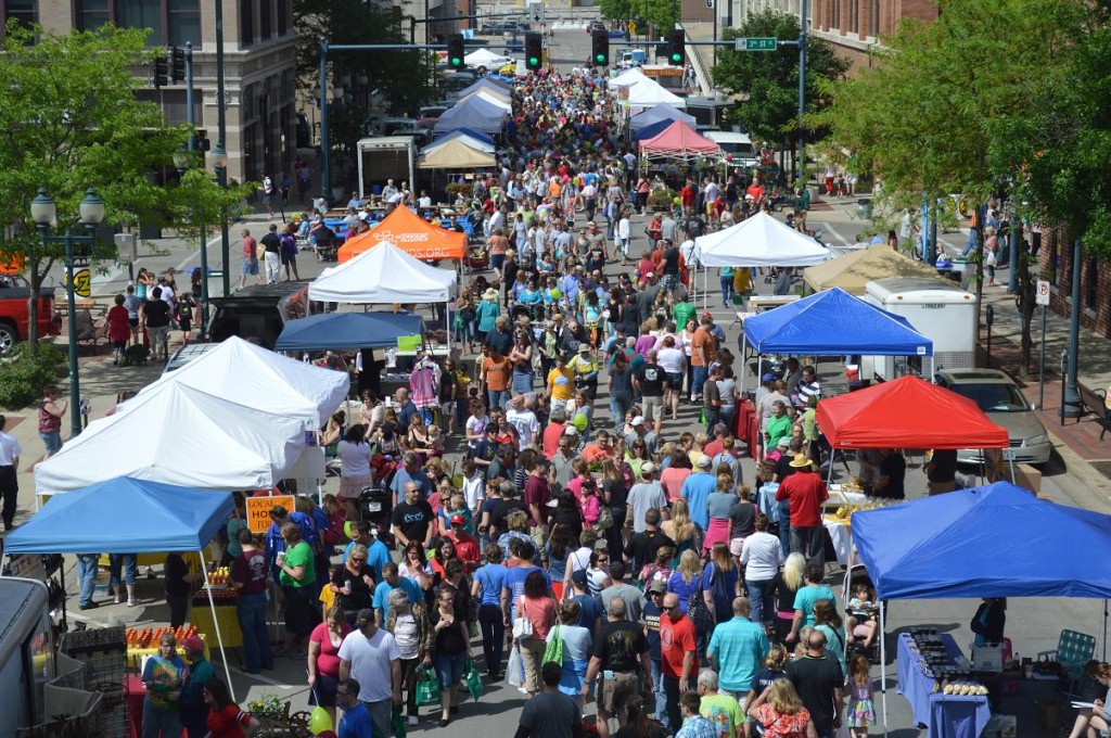 Shoppers make their way down Fourth Avenue SE in Cedar Rapids during the first Downtown Farmers Market of the season on Saturday, June 1, 2013. (photo/Cindy Hadish)