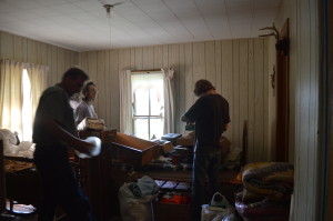 Relatives sort through collectibles on the Musel Century Farm in Chelsea, Iowa. (photo/Cindy Hadish)