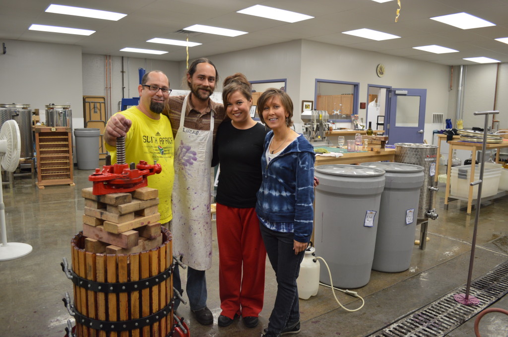 Viticulture instructor Lucas McIntire (in apron) nears the end of the eight-month Vineyard Management course at Kirkwood Community College with some of his students. (photo/Dave DeWitte)