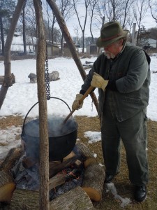 Volunteer Mike Duss of Cedar Rapids tends the pot Sunday, March 3, 2013, during the Maple Syrup Festival at the Indian Creek Nature Center. The Nature Center will celebrate 40 years of programs with a Ground Hog Gala on Feb. 1, 2014. (photo/Cindy Hadish)