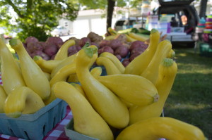 Yellow squash is sold during the Oxford Farmers Market in Johnson County, Iowa. The county is offering a public forum to discuss the local foods movement on Saturday, Feb. 8, 2014. (photo/Cindy Hadish)