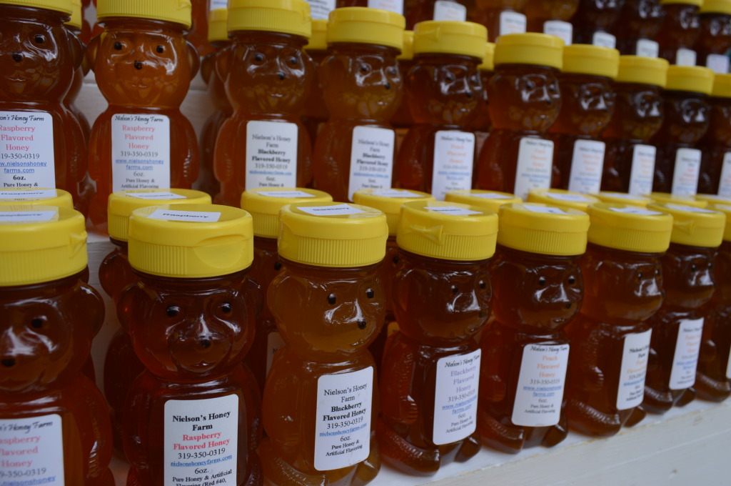 Honey in a variety of flavors is sold from Nielson's Honey Farm during Honey Fest at the Indian Creek Nature Center in Cedar Rapids. (photo/Cindy Hadish)