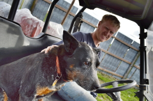 Jason Grimm and one of the family's dogs are shown at the farm near Williamsburg in October 2014. (photo/Cindy Hadish)