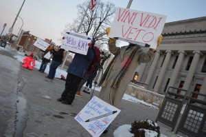 Protesters gather in front of the Linn County Courthouse on Tuesday, Jan. 13, to raise awareness about pipeline proposals and support President Obama's potential veto. (photo/Cindy Hadish)