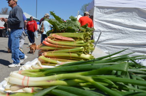 Onions and rhubarb are sold at the Hiawatha farmers market in April. The Village Farmers Market is seeking produce vendors and others for its new market, beginning June 13 in Czech Village. (photo/Cindy Hadish)