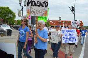 The March Against Monsanto makes its way through New Bohemia in Cedar Rapids. (photo/Cindy Hadish)