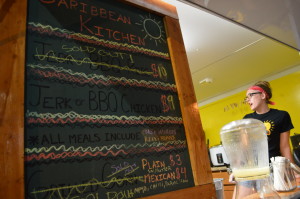 The Caribbean Kitchen's stand was so busy that some items sold out during Market After Dark. (photo/Cindy Hadish) 