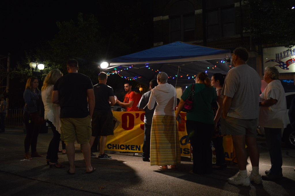 Customers line up for food from O's Grill on Saturday, Aug. 29, during the first Market After Dark in Cedar Rapids. (photo/Cindy Hadish)