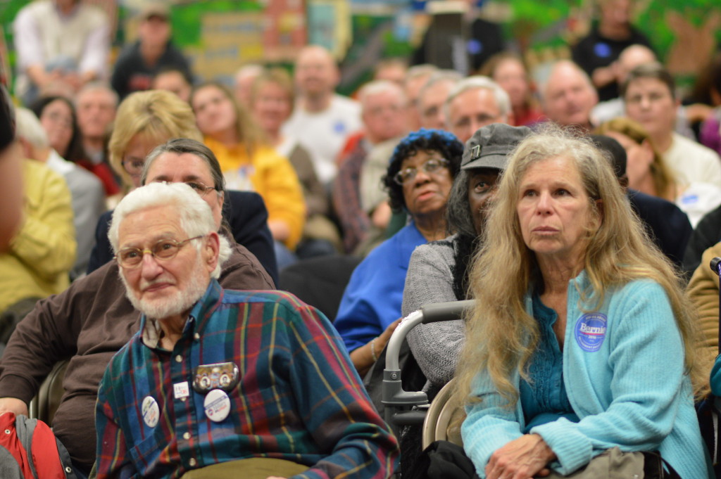 Attendees of Precinct 16 at Arthur Elementary School in Cedar Rapids listen to directions during the Iowa caucus on Monday, Feb. 1, 2016. (photo/Cindy Hadish)