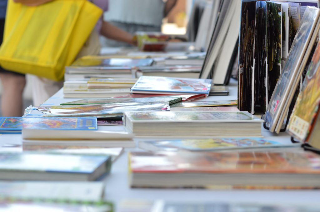 The Cedar Rapids Public Library sold books on the library steps during the opening day of the 2016 Downtown Farmers Market. (photo/Cindy Hadish)