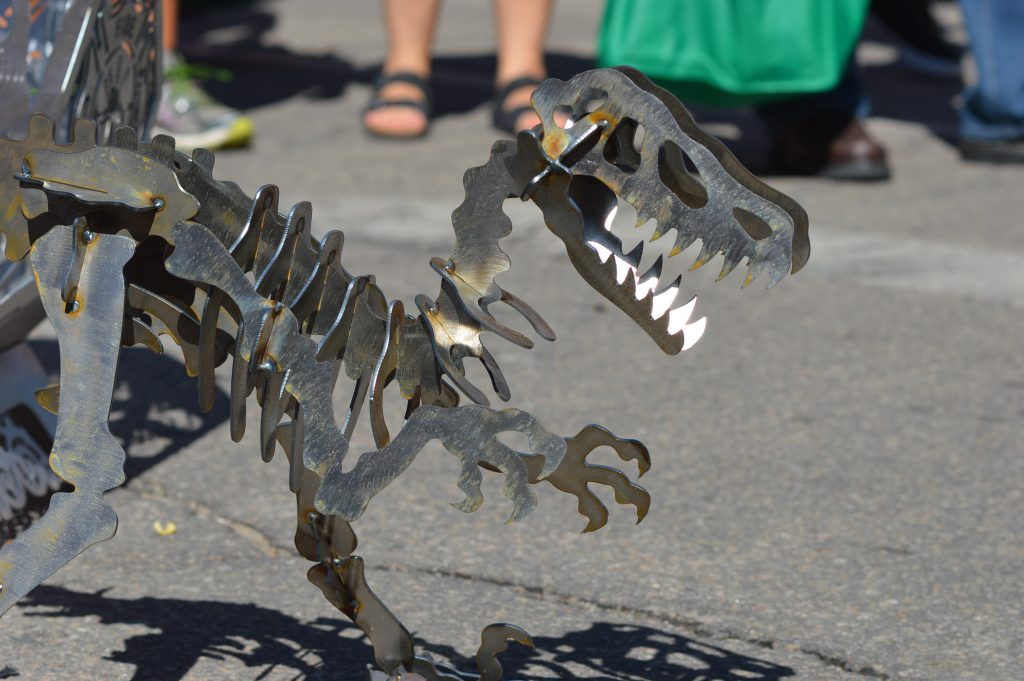 A dinosaur sculpture was among the items sold by Echo Valley Metalworks of West Union, Iowa, during the Downtown Farmers Market in Cedar Rapids. (photo/Cindy Hadish)