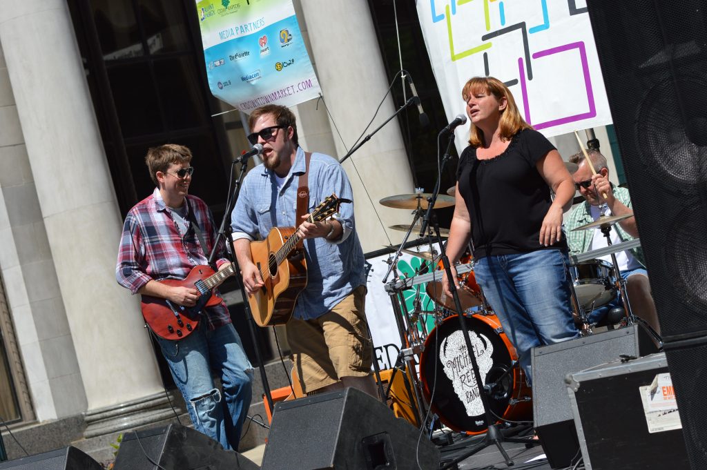 The Michael Reed Band, based in Waterloo, Iowa, performs during the opening day of the 2016 Downtown Farmers Market in Cedar Rapids. (photo/Cindy Hadish) 