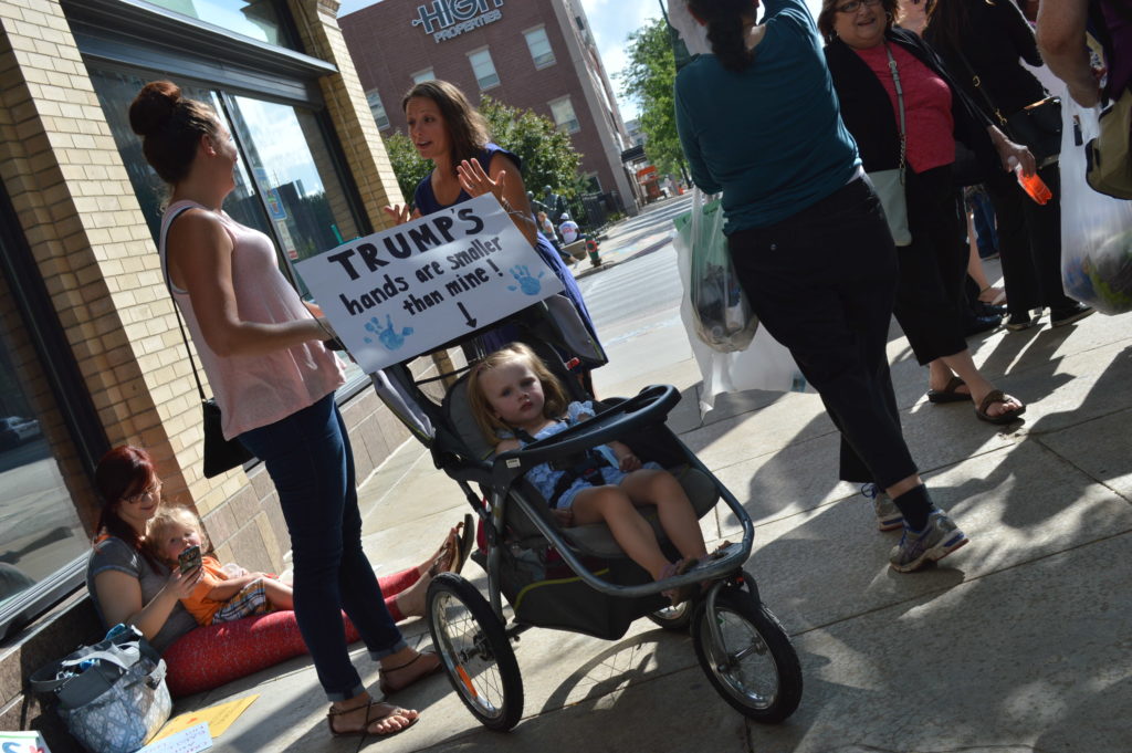 People of all ages joined in the protest against Republican presidential candidate Donald Trump in Cedar Rapids, Iowa. (photo/Cindy Hadish)