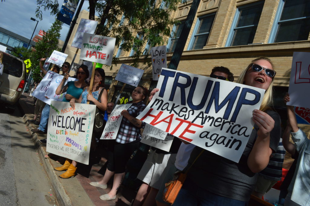 Protesters gather outside the Donald Trump rally in downtown Cedar Rapids, Iowa, on Thursday, July 28, 2016. (photo/Cindy Hadish)