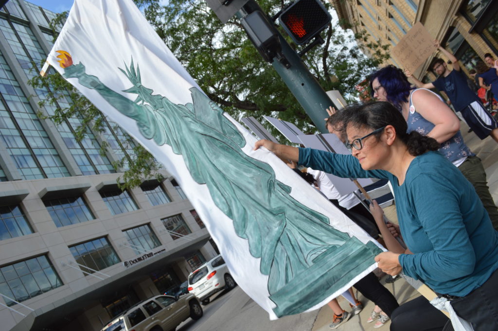  A lady liberty sign is hoisted in front of the DoubleTree by Hilton Hotel in downtown Cedar Rapids. (photo/Cindy Hadish)